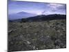 Rocky Terrain with Mountain in the Distance, Kilimanjaro-Michael Brown-Mounted Photographic Print