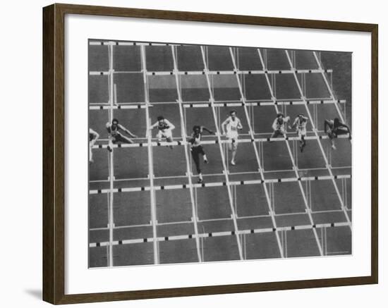 Rod Milburn Leading in the 110 Meter Hurdles at Summer Olympics-John Dominis-Framed Premium Photographic Print