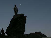 An Afghan Man Stands on a Huge Rock Next to the Now Abad Dinazung Monument-Rodrigo Abd-Photographic Print