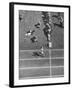 Roger Bannister Finishing a Race During the British Empire Games-null-Framed Premium Photographic Print
