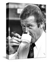 Roger Moore Drinking Coffee-Associated Newspapers-Stretched Canvas