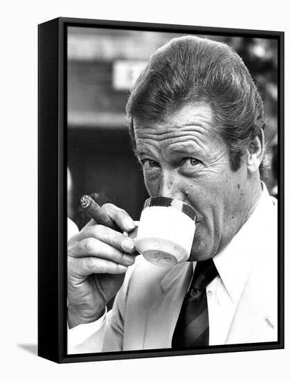 Roger Moore Drinking Coffee-Associated Newspapers-Framed Stretched Canvas