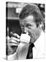 Roger Moore Drinking Coffee-Associated Newspapers-Stretched Canvas