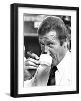 Roger Moore Drinking Coffee-Associated Newspapers-Framed Photo