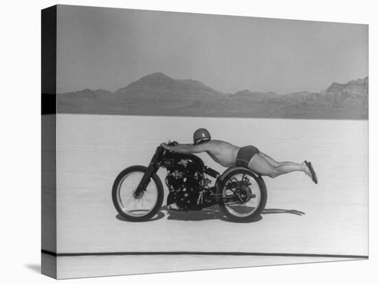 Roland Free Breaking World's Speed Record on Bonneville Salt Flats While Laying on His Bike-Peter Stackpole-Stretched Canvas