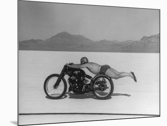 Roland Free Breaking World's Speed Record on Bonneville Salt Flats While Laying on His Bike-Peter Stackpole-Mounted Premium Photographic Print