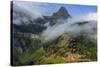 Rolling fog clouds with Reynolds Mountains at Logan Pass in Glacier National Park, USA-Chuck Haney-Stretched Canvas