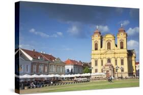 Roman Catholic Cathedral and Outdoor Cafes in Piata Unirii, Timisoara, Banat, Romania, Europe-Ian Trower-Stretched Canvas