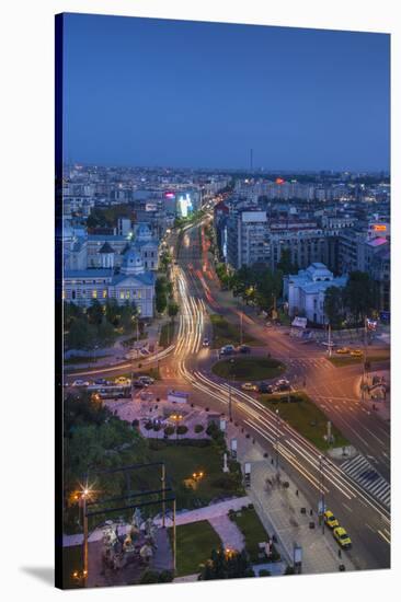 Romania, Bucharest, Piata Universitatii, Coltea Hospital at Dusk-Walter Bibikow-Stretched Canvas