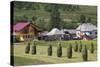 Romania, Maramures Region, Rona de Jos, Village View with Haystacks-Walter Bibikow-Stretched Canvas