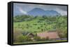 Romania, Transylvania, Bran, House and Bucegi Mountains, Spring-Walter Bibikow-Framed Stretched Canvas