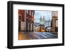 Romantic Atmosphere in Old Streets of Alfama with Castle in Background and Tram Number 28-Roberto Moiola-Framed Photographic Print