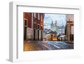 Romantic Atmosphere in Old Streets of Alfama with Castle in Background and Tram Number 28-Roberto Moiola-Framed Photographic Print