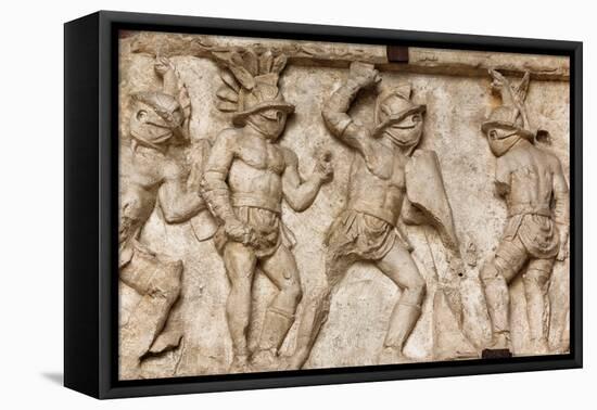 Rome, Italy. Bas relief in the Colosseum of gladiators fighting.-null-Framed Stretched Canvas