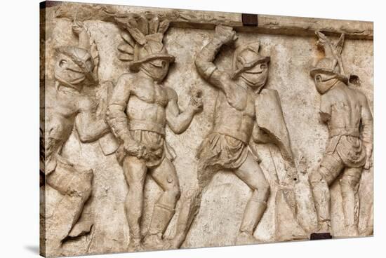 Rome, Italy. Bas relief in the Colosseum of gladiators fighting.-null-Stretched Canvas