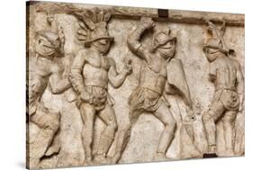 Rome, Italy. Bas relief in the Colosseum of gladiators fighting.-null-Stretched Canvas