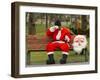 Ronald Guzman, Who Works as Santa Claus, Takes a Break in a Public Park in Lima, Peru-null-Framed Photographic Print