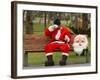 Ronald Guzman, Who Works as Santa Claus, Takes a Break in a Public Park in Lima, Peru-null-Framed Photographic Print