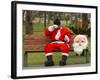 Ronald Guzman, Who Works as Santa Claus, Takes a Break in a Public Park in Lima, Peru-null-Framed Photographic Print