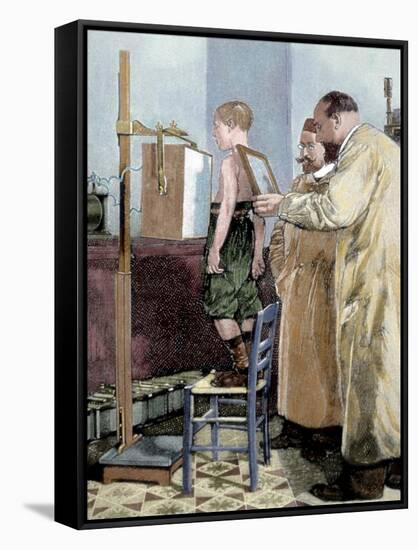 Rontgen, Wilhelm Conrad (1845-1923). German Physicist. Rontgen Exploring a Child with X-Ray Device-Tarker-Framed Stretched Canvas