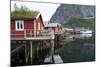 Rorbuer, traditional fishermnen's cottages now used for tourist accommodaton in Reine-Ellen Rooney-Mounted Photographic Print