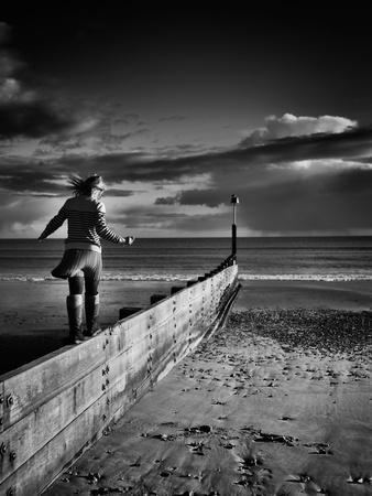 Girl Walking on Sea Defence