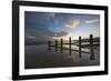 Rotting upright wooden posts of old sea defences on Winchelsea beach, Winchelsea, East Sussex-Stuart Black-Framed Photographic Print