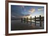 Rotting upright wooden posts of old sea defences on Winchelsea beach, Winchelsea, East Sussex-Stuart Black-Framed Photographic Print