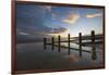 Rotting upright wooden posts of old sea defences on Winchelsea beach, Winchelsea, East Sussex-Stuart Black-Framed Photographic Print