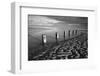 Rotting wooden posts of old sea defences on Winchelsea beach at low tide, Winchelsea, East Sussex-Stuart Black-Framed Photographic Print