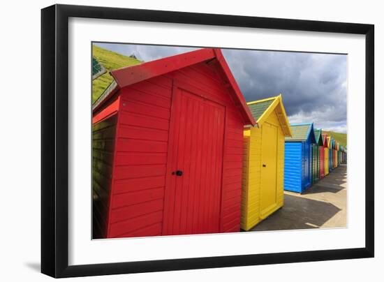 Row of Colourful Beach Huts and their Shadows, with Grassy Cliffs, West Cliff Beach-Eleanor Scriven-Framed Photographic Print