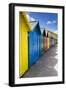 Row of Colourful Beach Huts and their Shadows with Green Hill Backdrop-Eleanor Scriven-Framed Photographic Print