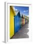 Row of Colourful Beach Huts and their Shadows with Green Hill Backdrop-Eleanor Scriven-Framed Photographic Print