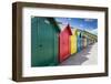 Row of Colourful Beach Huts and their Shadows with Green Hill Backdrop-Eleanor Scriven-Framed Photographic Print