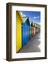 Row of Colourful Beach Huts and their Shadows with Green Hill Backdrop-Eleanor Scriven-Framed Photographic Print