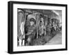 Row of Cows' Rumps, with Fat Cheeked Family of Six Milking Them, in Neat Cow Barn-Alfred Eisenstaedt-Framed Photographic Print