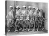 Row of Female Tennis Players in Matching Outfits-null-Stretched Canvas