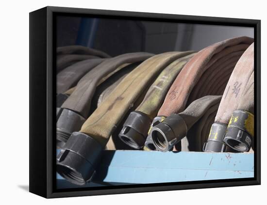 Row of Fire Hoses-null-Framed Stretched Canvas
