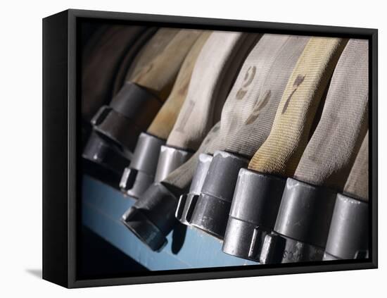 Row of Fire Hoses-null-Framed Stretched Canvas