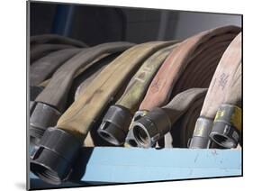 Row of Fire Hoses-null-Mounted Photographic Print