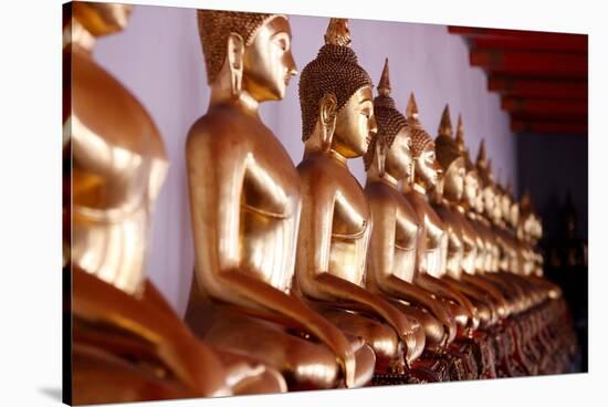 Row of golden Buddha statues, earth witness gesture, Wat Pho (Temple of the Reclining Buddha)-Godong-Stretched Canvas