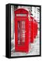 Row Of Iconic London Red Phone Cabins With The Rest Of The Picture In Black And White-Kamira-Framed Stretched Canvas