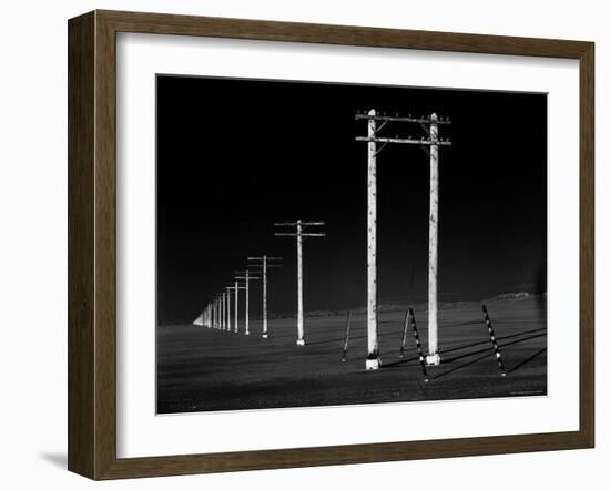 Row of Telephone Poles Along Bonneville Salt Flats-Fritz Goro-Framed Photographic Print