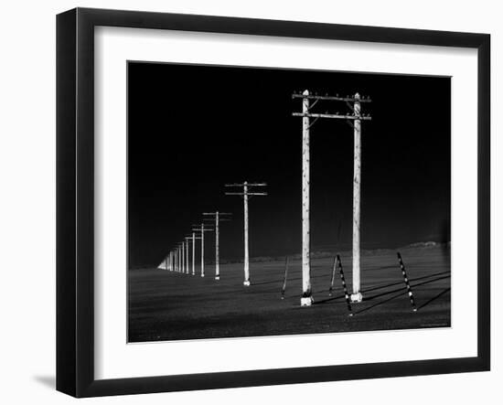 Row of Telephone Poles Along Bonneville Salt Flats-Fritz Goro-Framed Photographic Print