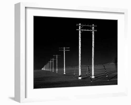 Row of Telephone Poles Along Bonneville Salt Flats-Fritz Goro-Framed Photographic Print