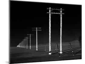 Row of Telephone Poles Along Bonneville Salt Flats-Fritz Goro-Mounted Photographic Print