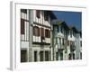 Row of Traditional Buildings in the Village of Ainhoa in the Pyrenees in Aquitaine, France-Michael Busselle-Framed Photographic Print