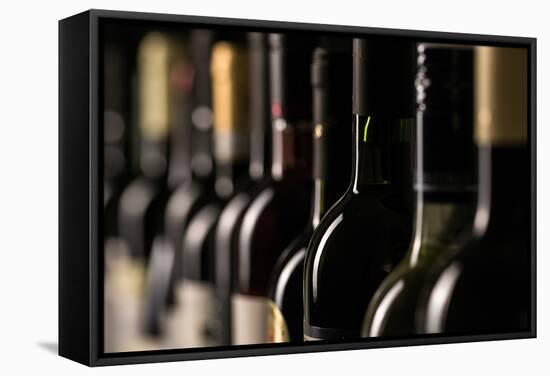 Row of Vintage Wine Bottles in a Wine Cellar (Shallow Dof; Color Toned Image)-l i g h t p o e t-Framed Stretched Canvas