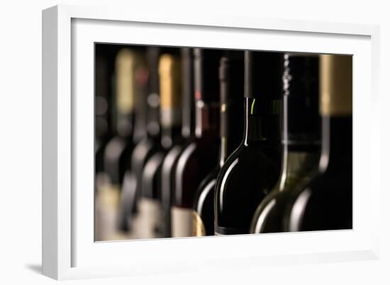 Row of Vintage Wine Bottles in a Wine Cellar (Shallow Dof; Color Toned Image)-l i g h t p o e t-Framed Photographic Print