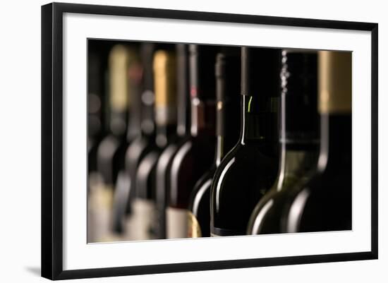 Row of Vintage Wine Bottles in a Wine Cellar (Shallow Dof; Color Toned Image)-l i g h t p o e t-Framed Photographic Print